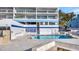 Community waterfront pool featuring a paved patio, fire pit and lounge furniture at 2 Adalia Ave # 803, Tampa, FL 33606