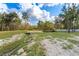Backyard with a decorative creek and access to a water feature and pond at 22259 Skyview Cir, Brooksville, FL 34602