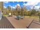 A large backyard deck offers outdoor seating, perfect for enjoying views of the surrounding trees and landscaping at 22259 Skyview Cir, Brooksville, FL 34602