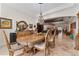 Elegant dining room featuring ornate wood furniture, decorative chandelier, tile flooring, and a spacious design at 22259 Skyview Cir, Brooksville, FL 34602
