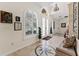 Inviting foyer with tiled flooring, a decorative compass design, arched entryway, and a chandelier at 22259 Skyview Cir, Brooksville, FL 34602