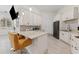 Kitchen boasts white cabinetry, counter seating and stainless steel appliances at 22259 Skyview Cir, Brooksville, FL 34602