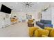 Open concept living room with modern furnishings and abundant natural light at 22259 Skyview Cir, Brooksville, FL 34602