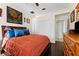Main bedroom with wood floors, closet doors and decorative accents at 22259 Skyview Cir, Brooksville, FL 34602