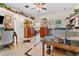 Bright and airy office space with tile flooring, vintage furniture, built-in storage, and views of the backyard at 22259 Skyview Cir, Brooksville, FL 34602