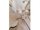 Beautiful walk-in shower with bench, arched window, and decorative tile work at 22259 Skyview Cir, Brooksville, FL 34602