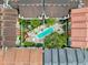 Aerial view of residential buildings with central pool, spa and dining at 2410 W Azeele St # 220, Tampa, FL 33609