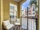 Inviting balcony features outdoor seating and charming views at 2410 W Azeele St # 220, Tampa, FL 33609