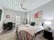 Bedroom featuring slatted ceilings, a ceiling fan, and neutral decor at 2410 W Azeele St # 220, Tampa, FL 33609