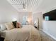 Bedroom with neutral tones, comfortable bedding, and stylish decor at 2410 W Azeele St # 220, Tampa, FL 33609