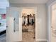 Bedroom with white closet doors, mirrored door and bathroom doorway at 2410 W Azeele St # 220, Tampa, FL 33609