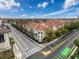 Corner view of the buildings featuring red tile roofing and lush landscaping at 2410 W Azeele St # 220, Tampa, FL 33609