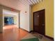 Hallway featuring unit 220, bright overhead lighting, exit sign and stairway access at 2410 W Azeele St # 220, Tampa, FL 33609