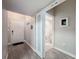 Hallway leading to a bathroom and entrance, with modern fixtures and tiled flooring at 2410 W Azeele St # 220, Tampa, FL 33609