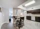 Open-concept view of the kitchen featuring a breakfast bar and easy access to the living area at 2410 W Azeele St # 220, Tampa, FL 33609
