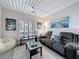 Comfortable living room with ample seating, plantation shutters, and stylish decor at 2410 W Azeele St # 220, Tampa, FL 33609