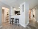 Partial kitchen view with seating and a step down into the adjacent living area at 2410 W Azeele St # 220, Tampa, FL 33609