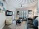 Cozy living room features wood-look tile flooring, comfortable seating, and modern decor at 2410 W Azeele St # 220, Tampa, FL 33609