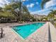 Relaxing pool area with inviting, crystal-clear water and comfortable lounging at 2410 W Azeele St # 220, Tampa, FL 33609