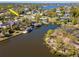 An aerial view of a home with a private boat dock and access to open water at 27 Park Ave, Tarpon Springs, FL 34689