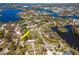 A high aerial view showcasing the property's neighborhood and proximity to multiple waterways at 27 Park Ave, Tarpon Springs, FL 34689