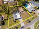 Aerial view highlighting the property's layout, showcasing the home, yard, and surrounding neighborhood at 27 Park Ave, Tarpon Springs, FL 34689