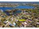 Aerial view of the property within a community near a lake and neighborhood amenities at 27 Park Ave, Tarpon Springs, FL 34689