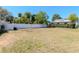 Large backyard features a well maintained white vinyl fence and ample space at 27 Park Ave, Tarpon Springs, FL 34689