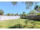 Fenced backyard showing a well maintained white vinyl fence and privacy at 27 Park Ave, Tarpon Springs, FL 34689