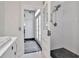 Stylish bathroom showcasing sleek white tiles, modern fixtures and natural light at 27 Park Ave, Tarpon Springs, FL 34689