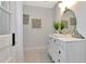 Charming bathroom boasting black and white tile floors and an ornate vanity at 27 Park Ave, Tarpon Springs, FL 34689