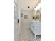 Charming bathroom boasting black and white tile floors and an ornate vanity at 27 Park Ave, Tarpon Springs, FL 34689