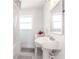 Bright bathroom features modern fixtures, black and white tile, and natural light at 27 Park Ave, Tarpon Springs, FL 34689