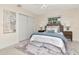 Serene bedroom with soft lighting, comfortable bed, and closet space at 27 Park Ave, Tarpon Springs, FL 34689