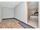 Light-filled bonus room with painted brick and ceiling, seamlessly connected to bedroom at 27 Park Ave, Tarpon Springs, FL 34689