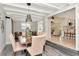 Open-concept dining room with seamless access to the kitchen and adjacent sitting area, perfect for entertaining at 27 Park Ave, Tarpon Springs, FL 34689