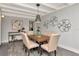 Charming dining room with a wooden table, stylish chairs, and decorative wall art for a modern touch at 27 Park Ave, Tarpon Springs, FL 34689