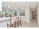 Stylish kitchen with modern appliances, white countertops, and bar seating at 27 Park Ave, Tarpon Springs, FL 34689