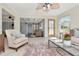 Spacious living area with lots of light, stylish furnishings, and an open layout to other rooms at 27 Park Ave, Tarpon Springs, FL 34689