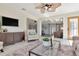 Bright and open living space with hardwood floors, stylish furniture, and natural light at 27 Park Ave, Tarpon Springs, FL 34689