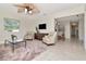 Open-concept living room flowing into the dining area, featuring modern decor and ample seating at 27 Park Ave, Tarpon Springs, FL 34689