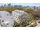 Aerial view of a townhouse complex, highlighting the modern architecture, rooftop decks, and urban setting at 305 15Th N St, St Petersburg, FL 33705