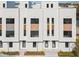 Modern townhome exterior featuring sleek white facade and clean architectural lines at 305 15Th N St, St Petersburg, FL 33705