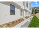 Close-up exterior view of the townhouses, showcasing the architectural details, landscaping, and modern design at 305 15Th N St, St Petersburg, FL 33705