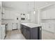 Contemporary kitchen with an island, white cabinets, stainless steel appliances, and lots of counter space at 305 15Th N St, St Petersburg, FL 33705