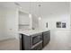 Spacious kitchen island with microwave and seating, open to the living area at 305 15Th N St, St Petersburg, FL 33705
