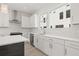 Modern kitchen with stainless steel appliances, white cabinets, and quartz countertops at 305 15Th N St, St Petersburg, FL 33705