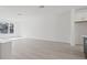 A spacious living room with recessed lighting, wood-look floors, and a large window at 305 15Th N St, St Petersburg, FL 33705