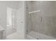 Walk-in shower with tiled walls, glass door, and modern fixtures at 305 15Th N St, St Petersburg, FL 33705