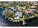 Waterfront home with private pool and boat dock, nestled among lush landscaping and sparkling waterways at 3399 Maple Ne St, St Petersburg, FL 33704
